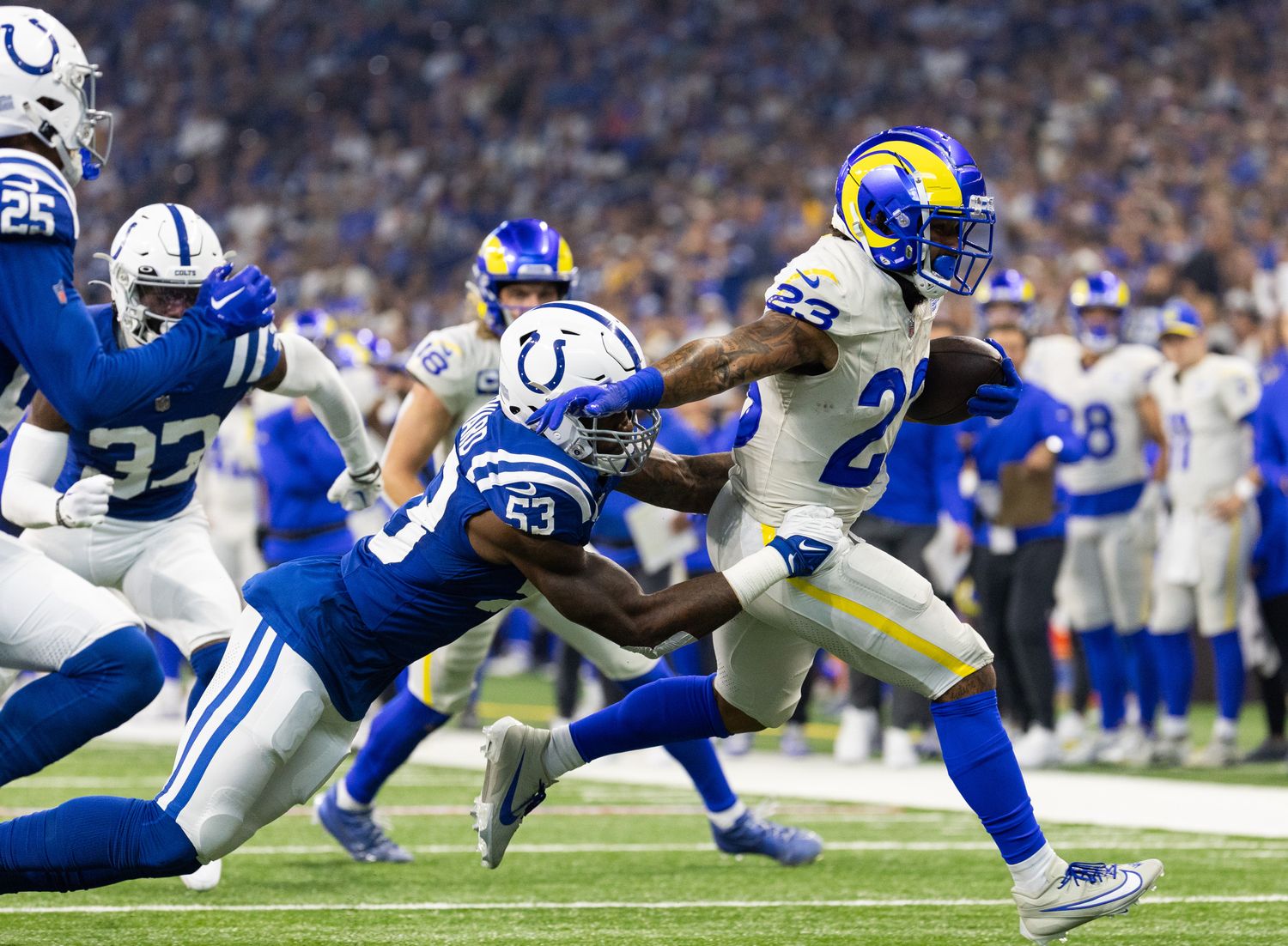 Oct 1, 2023; Indianapolis, Indiana, USA; Los Angeles Rams running back Kyren Williams (23) runs the ball while Indianapolis Colts linebacker Shaquille Leonard (53) defends in the first quarter at Lucas Oil Stadium. Mandatory Credit: Trevor Ruszkowski-USA TODAY Sports